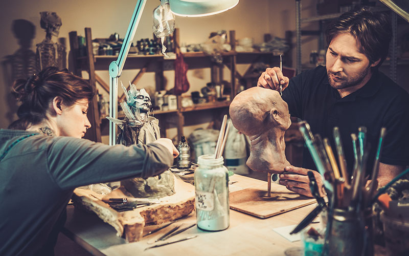 People working in a prosthetic special fx workshop